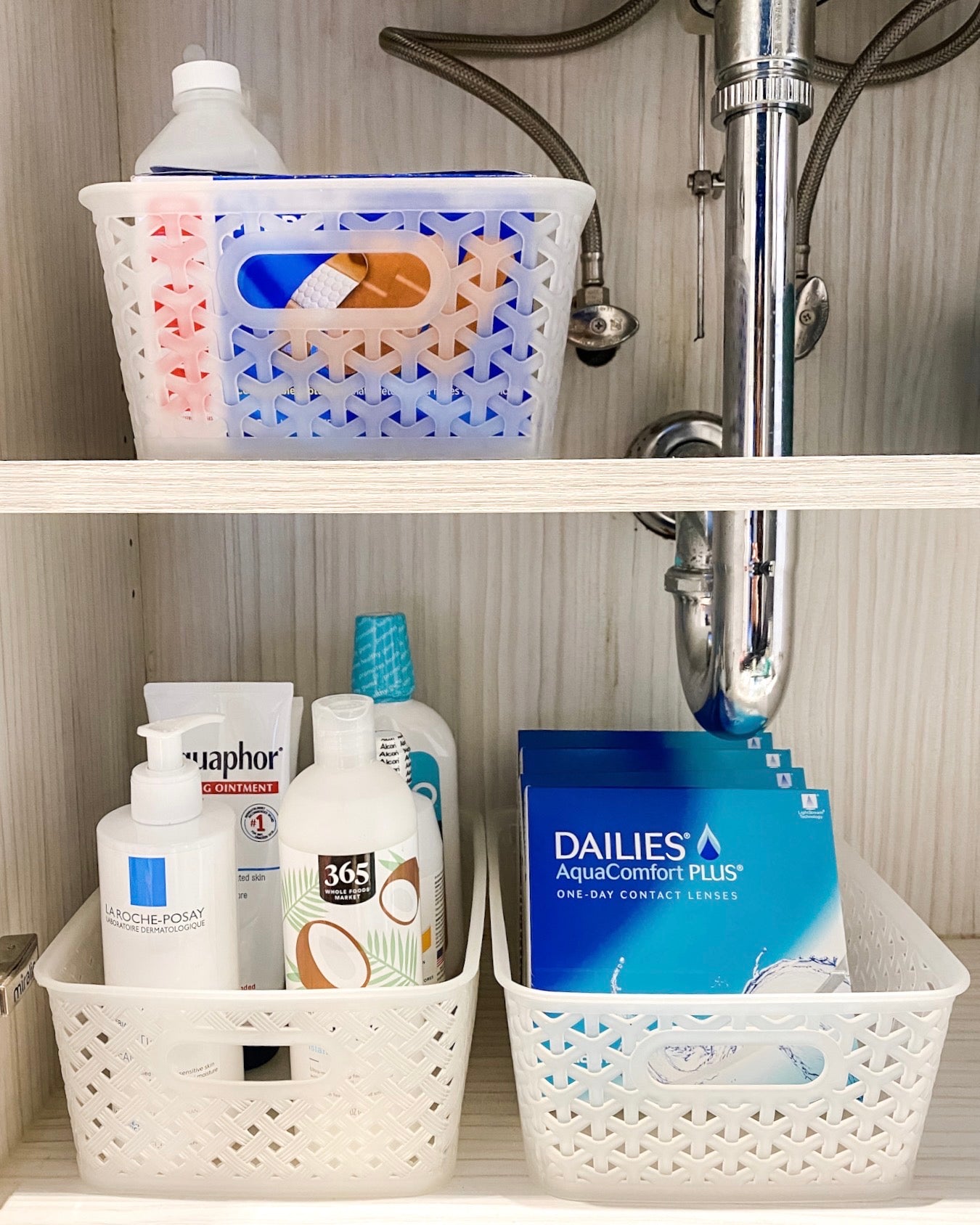 Organized Area Under Bathroom Sink with Clear Bins | thetidyspot.com