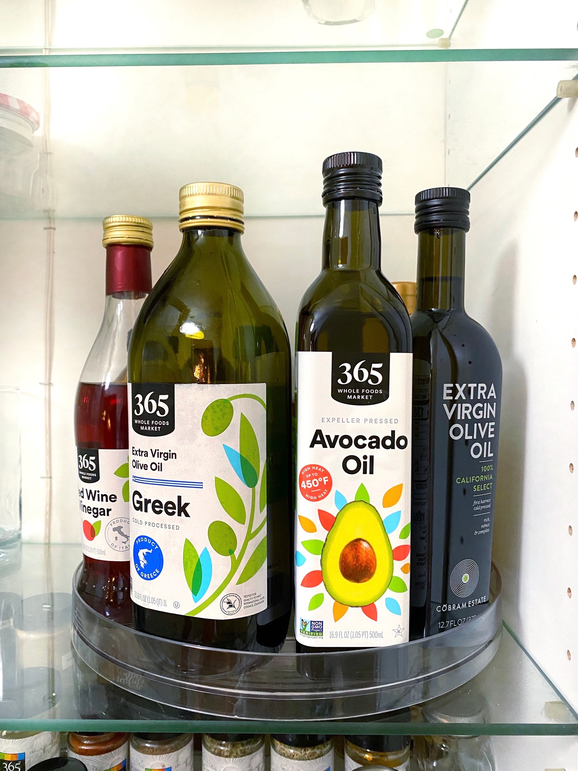 Oil and Vinegar Bottles on a Clear Lazy Susan / Turntable in Kitchen Pantry | thetidyspot.com