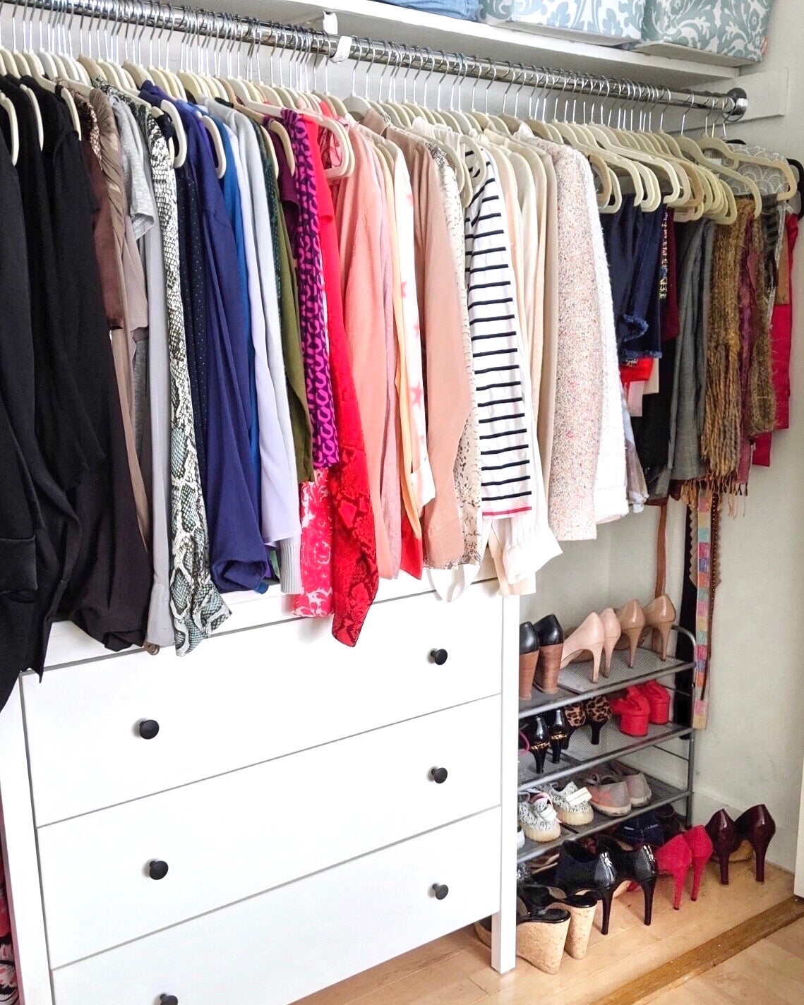 Organized Master Bedroom Closet with Hanging Women's Clothes | thetidyspot.com